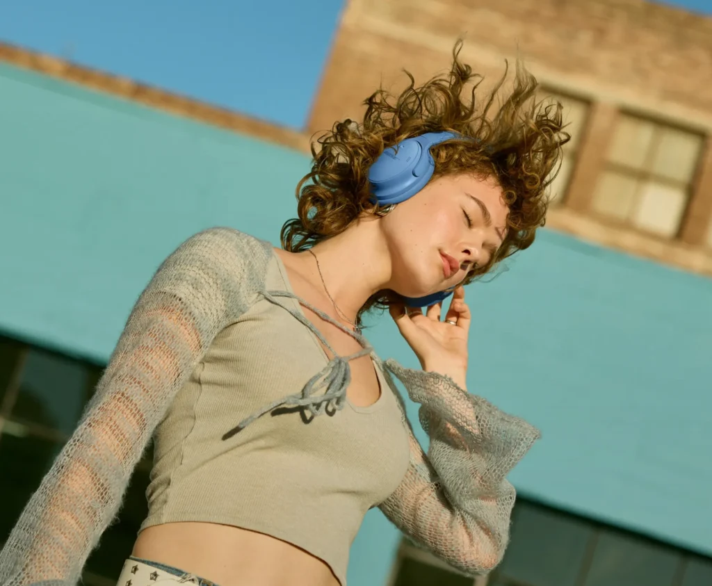 Bose QuietComfort headphones showcasing superior noise cancellation in a busy setting