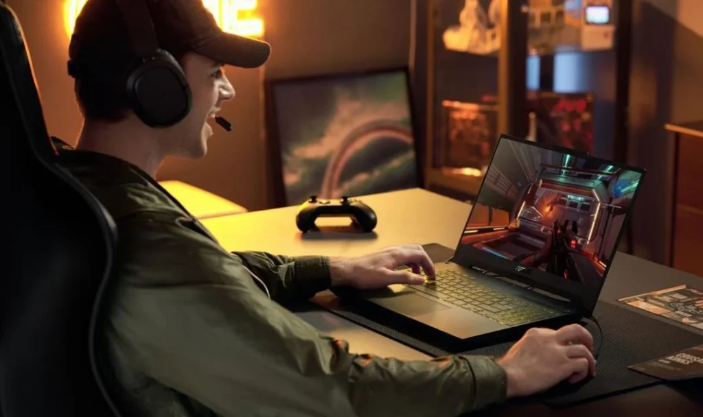 Asus TUF Gaming laptop displaying a vibrant game with crisp visuals, showcasing its customizable backlit keyboard and powerful performance for budget-conscious gamers.