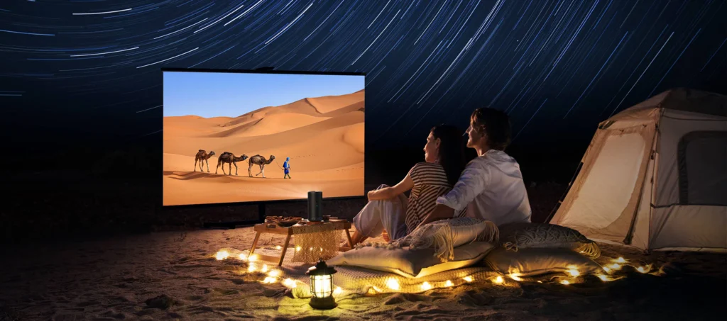Anker Nebula Capsule 3 Laser portable projector casting a vibrant movie scene onto a wall, highlighting its compact size and clear image.