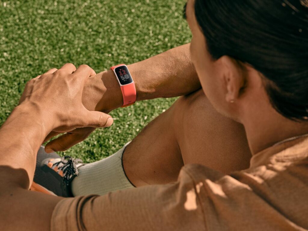 Fitbit Charge 6 on a wrist displaying the time, highlighting its sleek and comfortable design for everyday wear.
