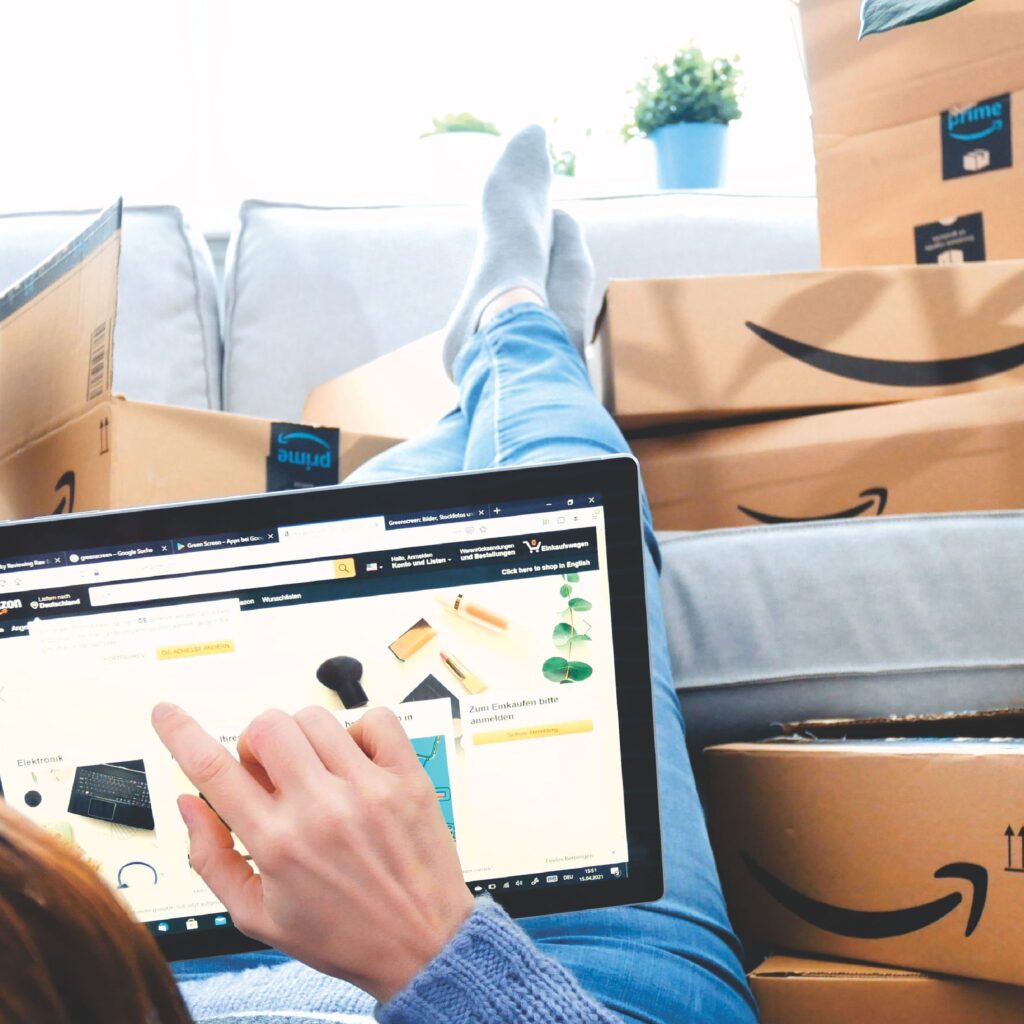 Smart Amazon shopper using a laptop to find deals and services in 2025.