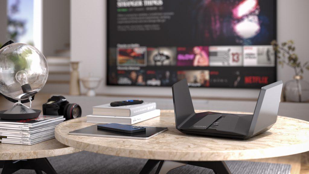 A close-up of a TP-Link Deco mesh Wi-Fi unit, showing its minimalist design and glowing status light, placed on a modern shelf, representing seamless whole-home Wi-Fi coverage
