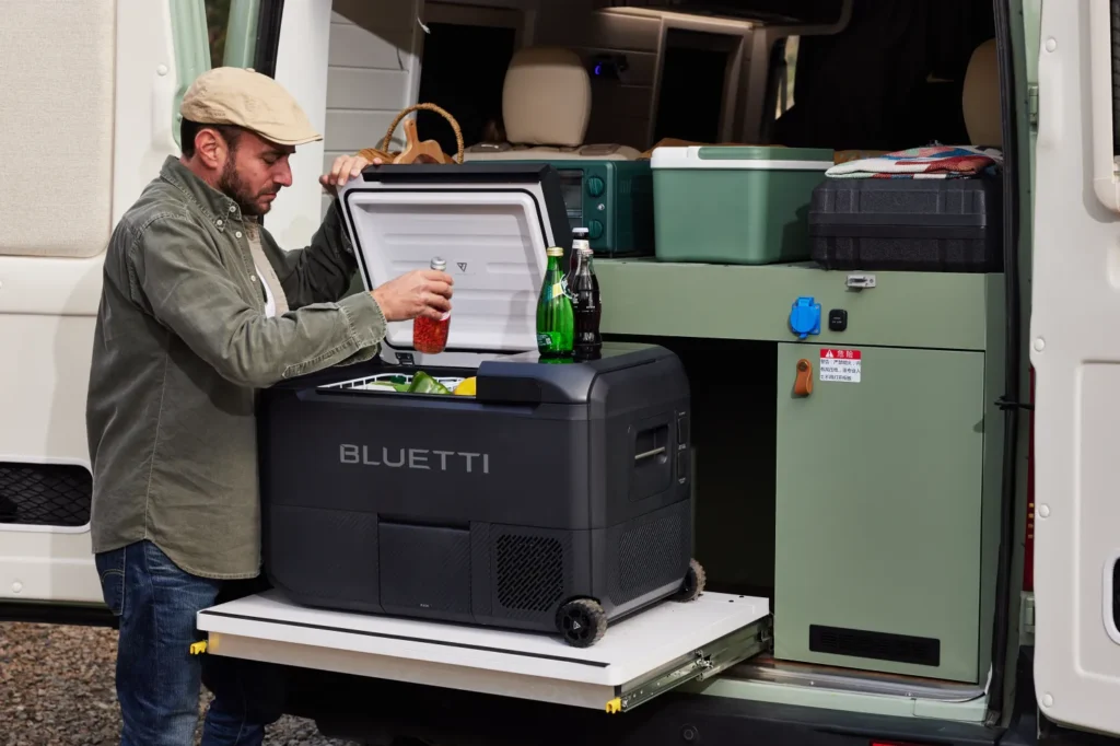 Bluetti portable power station providing reliable energy for camping lights and devices in a rustic outdoor environment