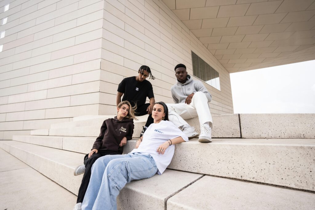 Diverse models showcasing sustainable, gender-neutral fashion trends for 2025