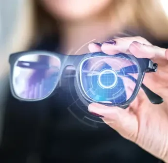 Top Wearable Tech Devices You Need in 2025 for Health & Productivity A person wearing Vital Smart Glasses, demonstrating augmented reality for enhanced focus and productivity