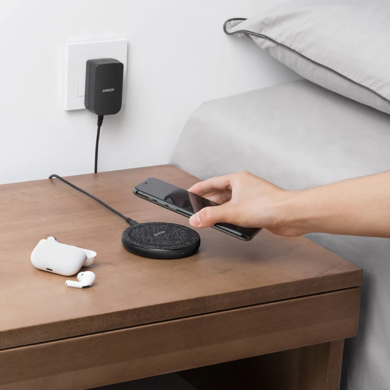A clean product shot of the Anker PowerWave II Pad, emphasizing its simple, round design and non-slip surface