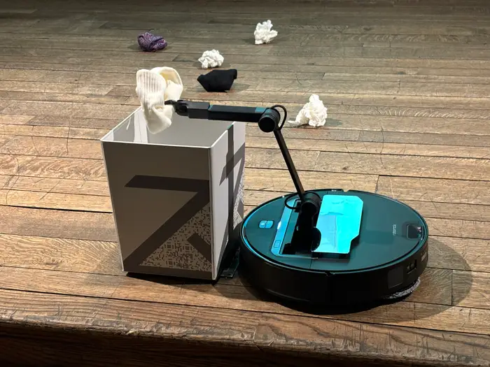 Top Trending Tech Gadgets Everyone is Buying in 2025 Alt Text: Roborock Saros Z70, a state-of-the-art robot vacuum with an AI-powered mechanical arm.