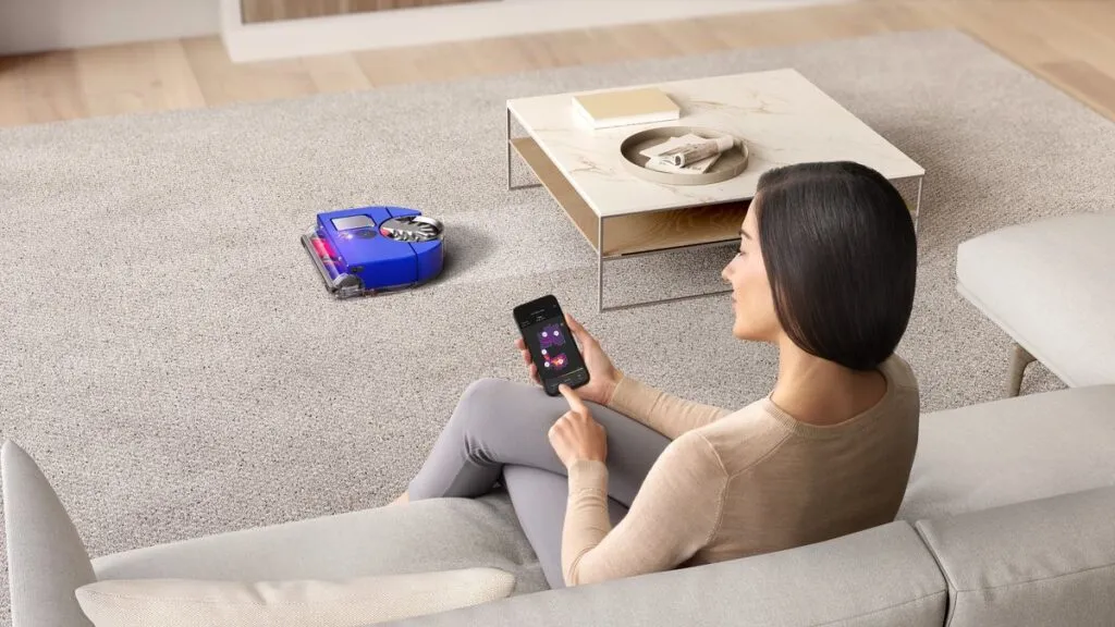 The Top 10 AI-Powered Gadgets Everyone Is Using in 2026 Dyson 360 Vis Nav robot vacuum cleaning a home with AI gadgets mapping