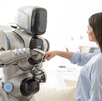 A human and an AI robot collaborating on a project, illustrating the revolution of generative AI in the workplace in 2025